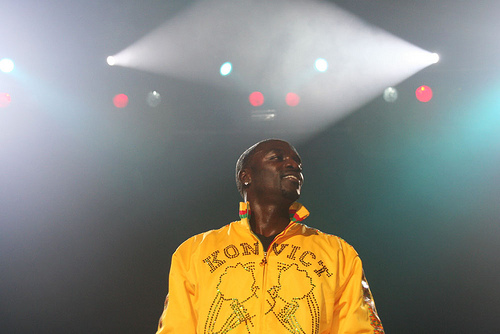 Akon performing in a concert. Image from Flickr by Celso Tavares via Funchal. Used under a Creative Commons License